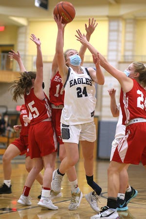 Plymouth North's Megan Banzi loses her shoe but gets the layup to cut the lead to 9-4 in the first quarter of their game against Hingham at Plymouth North on Friday, Jan. 15, 2021.