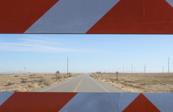 Navajo Route 4178 is seen through barriers on Jan. 15 at Navajo Agricultural Products Industry south of Farmington.