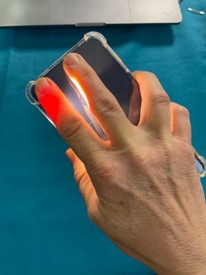 Jennifer Jolly takes her blood pressure with a smartphone camera using the OptiBP app. The app, which is released on Android in beta form now, uses algorithms to figure out pulse and blood pressure.