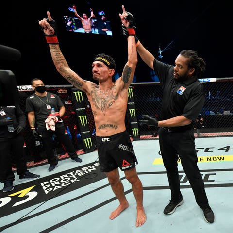 Max Holloway celebrates after his unanimous-decisi