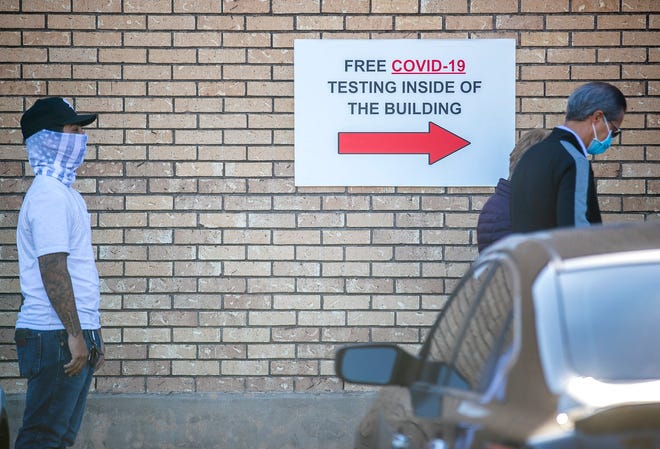 People waited in line to get a free COVID-19 test in downtown Pflugerville on Thursday, December 16, 2020. [AMERICAN-STATESMAN/FILE]