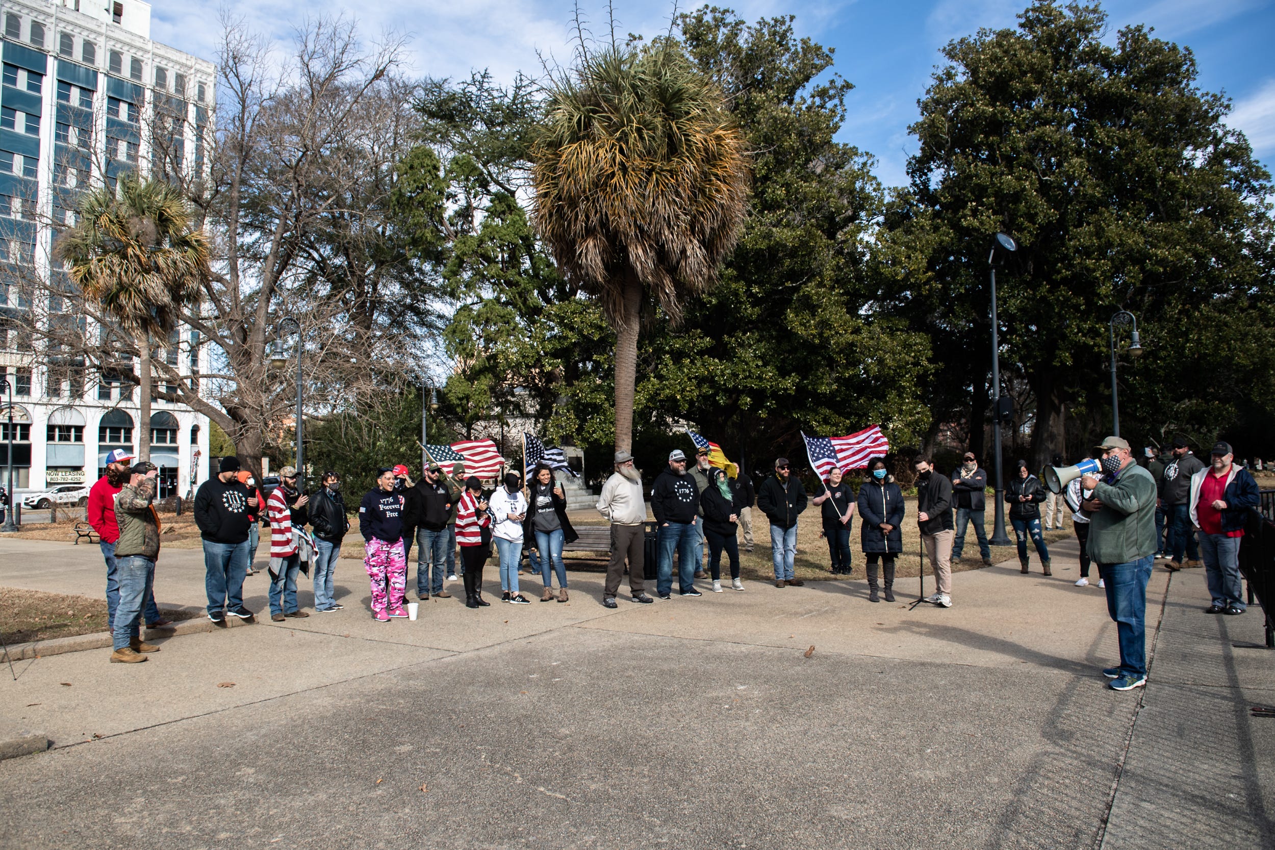 A group of people who support free speech and oppose what they view as being silenced by social media gather at the South Carolina State House in Columbia on Sunday, Jan. 17, 2021.