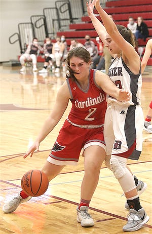 Sandy Valley's Alli Neary (2), shown here in a game against Dover, scored 22 points in the Cardinals' season-opening win over Central Catholic on Monday.