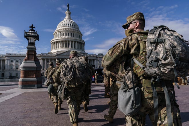 National Guard troops reinforce security around the U.S. Capitol ahead of expected protests leading up to President-elect Joe Biden's inauguration, in Washington, Sunday, Jan. 17, 2021, following the deadly attack on Congress by a mob of supporters of President Donald Trump. (AP Photo/J. Scott Applewhite)