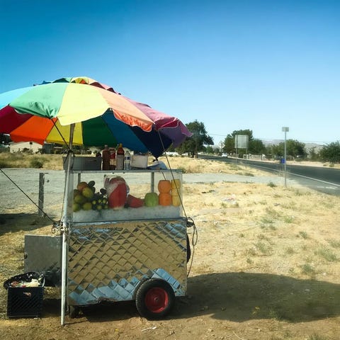 A fruit vending cart is pictured in this undated p