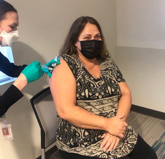 Teri Gobin, 63, chairwoman of the Tulalip Tribes in Snohomish County, Wash., receives her first dose of vaccine on the Tulalip Reservation. Gobin was terrified when the county reported the first case of COVID-19. Her daughter-in-law was at Providence Regional Medical Center receiving treatment for respiratory issues when the first patient arrived. "Everything was kind of a shock at first. It was like no, this can’t really be happening," Gobin said. "I was telling her, you need to get out when you can. We didn’t know anything about what was coming forward. She got to get out the next day."