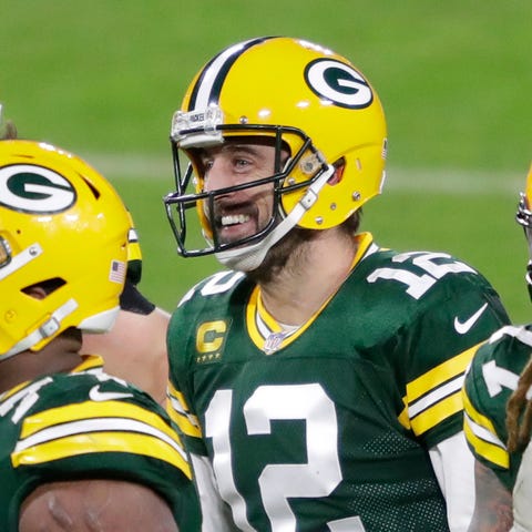QB Aaron Rodgers (12) and the Packers were all smi