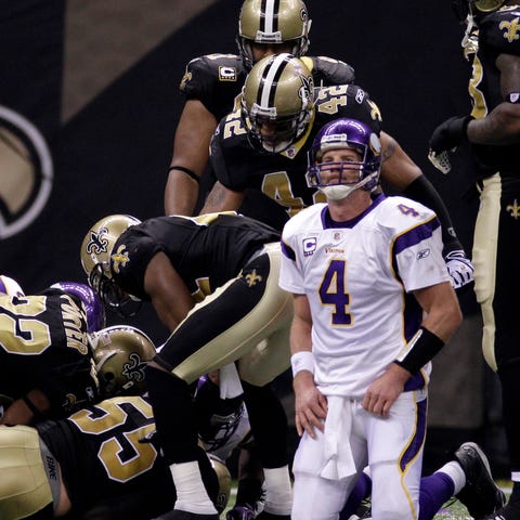 Minnesota Vikings quarterback Brett Favre (4) reac