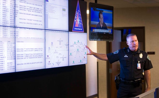Then-Assistant Chief David Carter of the Austin Police Department speaks in 2011 about the Austin Regional Intelligence Center at a media event.