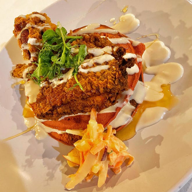 Fried chicken and red velvet pancakes, topped with a honey yogurt sauce, is one of the menu items at Sote Gastropub.