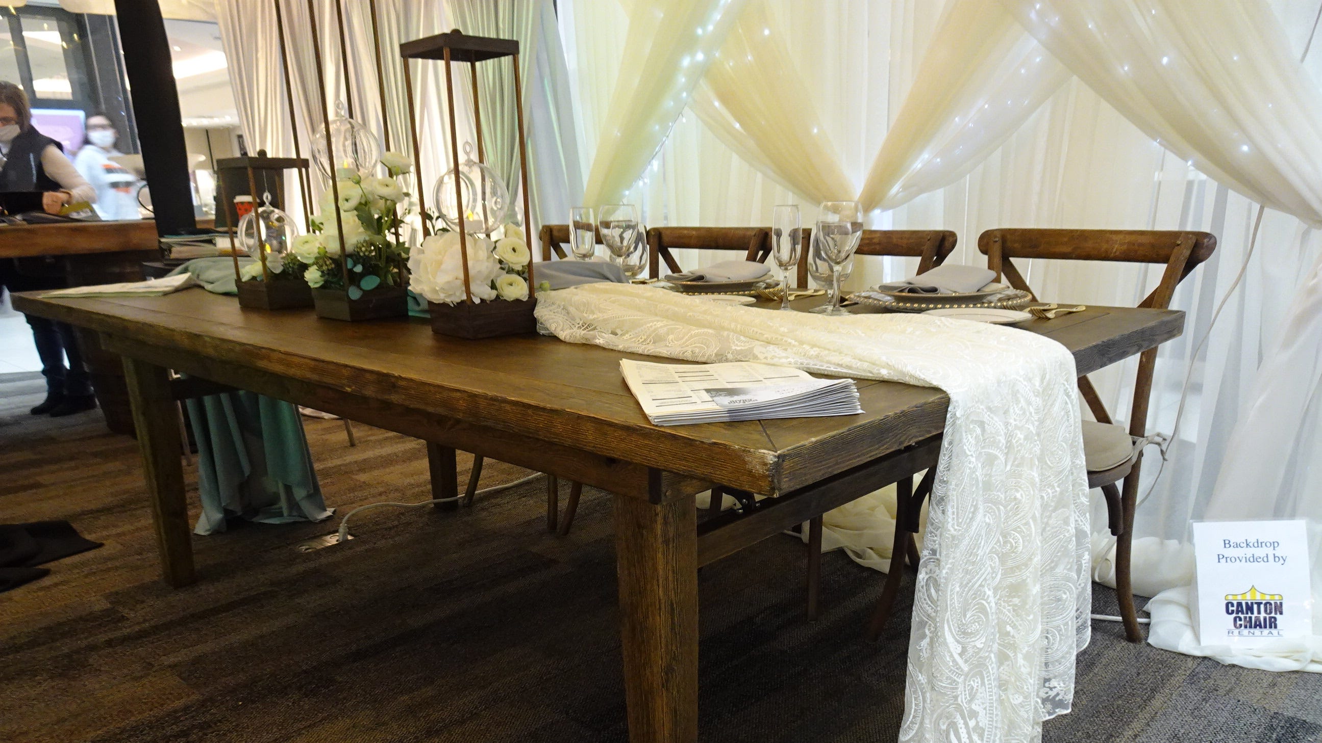 This rustic style table and farm chairs was setup at the Canton Chair Rental booth. Store manager Anne Haines said rustic and vintage rustic furniture is still highly popular this year.