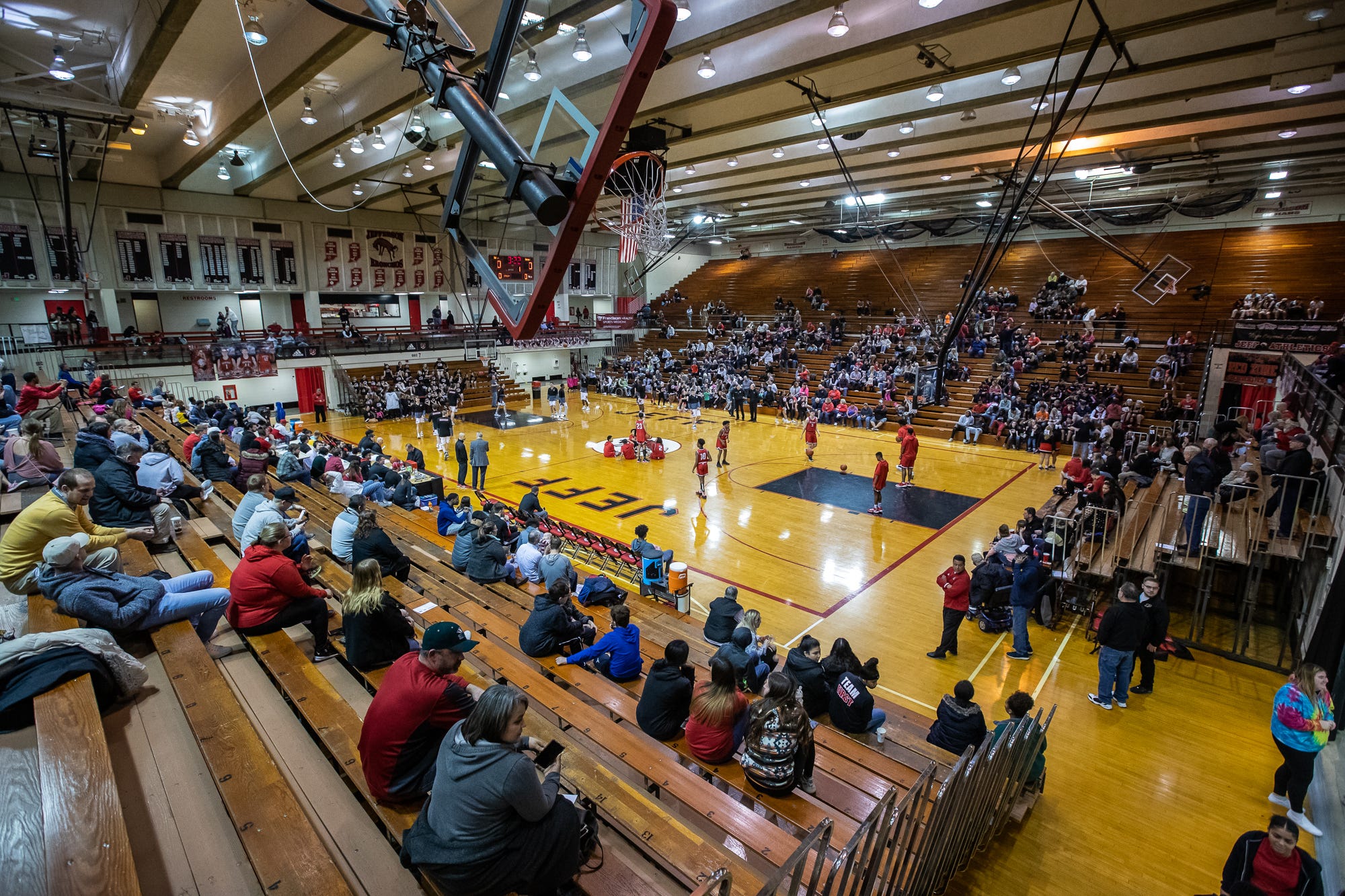 Fans watch as the Lafayette Jefferson Bronchos warm up for their game against the Richmond Red Devils at Jefferson High School's Marion Crawley Athletic Center on Friday, Feb. 21, 2020.