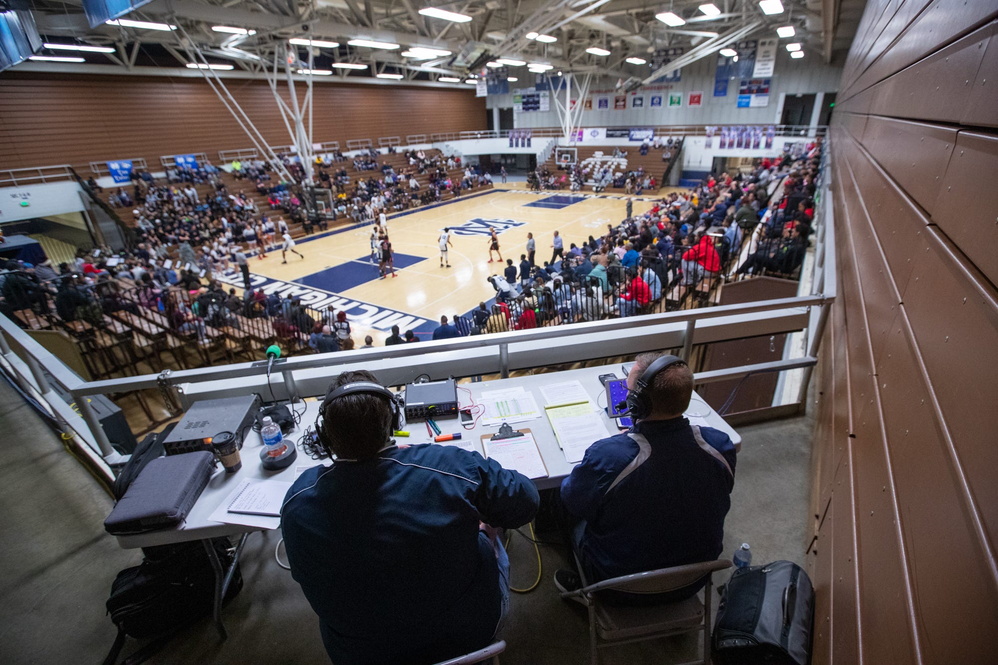 Fans watch as the Michigan City Wolves face off against the Portage Indians inside the Wolves Den gymnasium on Friday, Jan. 31, 2020.