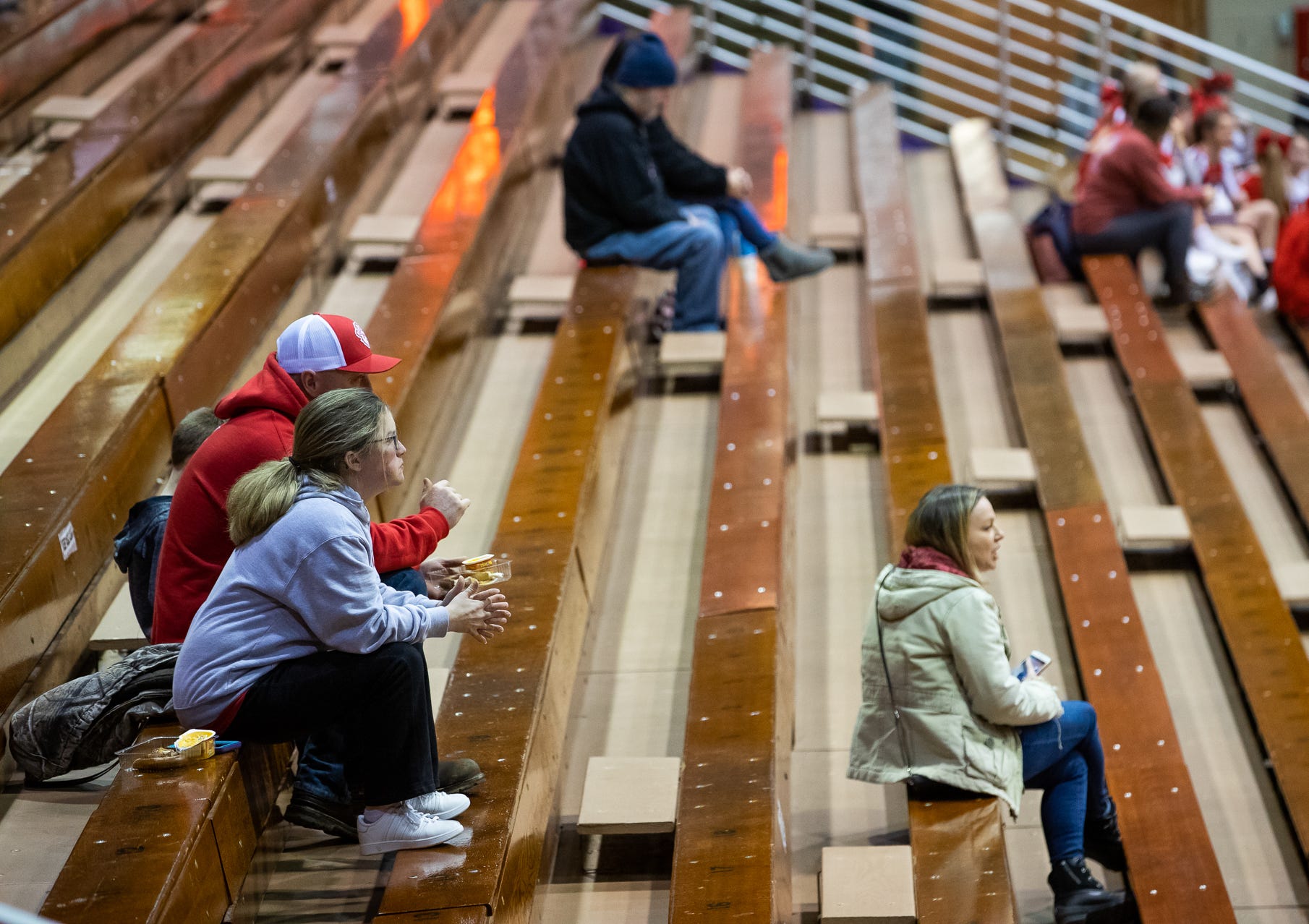 Fans watch as the Seymour Owls and Madison Cubs face off at Seymour High School's Lloyd E. Scott Gymnasium on Thursday, Feb. 6, 2020.