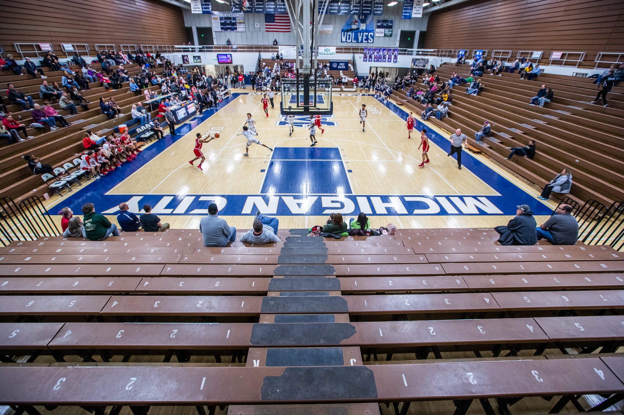 Fans watch as the Michigan City Wolves face off against the Portage Indians inside the Wolves Den gymnasium on Friday, Jan. 31, 2020.