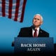 Former Vice President Mike Pence and his family join him as he gives remarks to a small crowd on Wednesday, Jan. 20, 2021 at Columbus Municipal Airport in Columbus, Ind. 