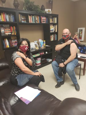 Las Cruces Public Schools Superintendent Karen Trujillo, left, and Hatch Superintendent Michael Chavez receive their first dose of the COVID-19 vaccine on Tuesday, Jan. 19, 2021. Chavez said that about 40% of HVPS staff have received their first round of vaccinations.