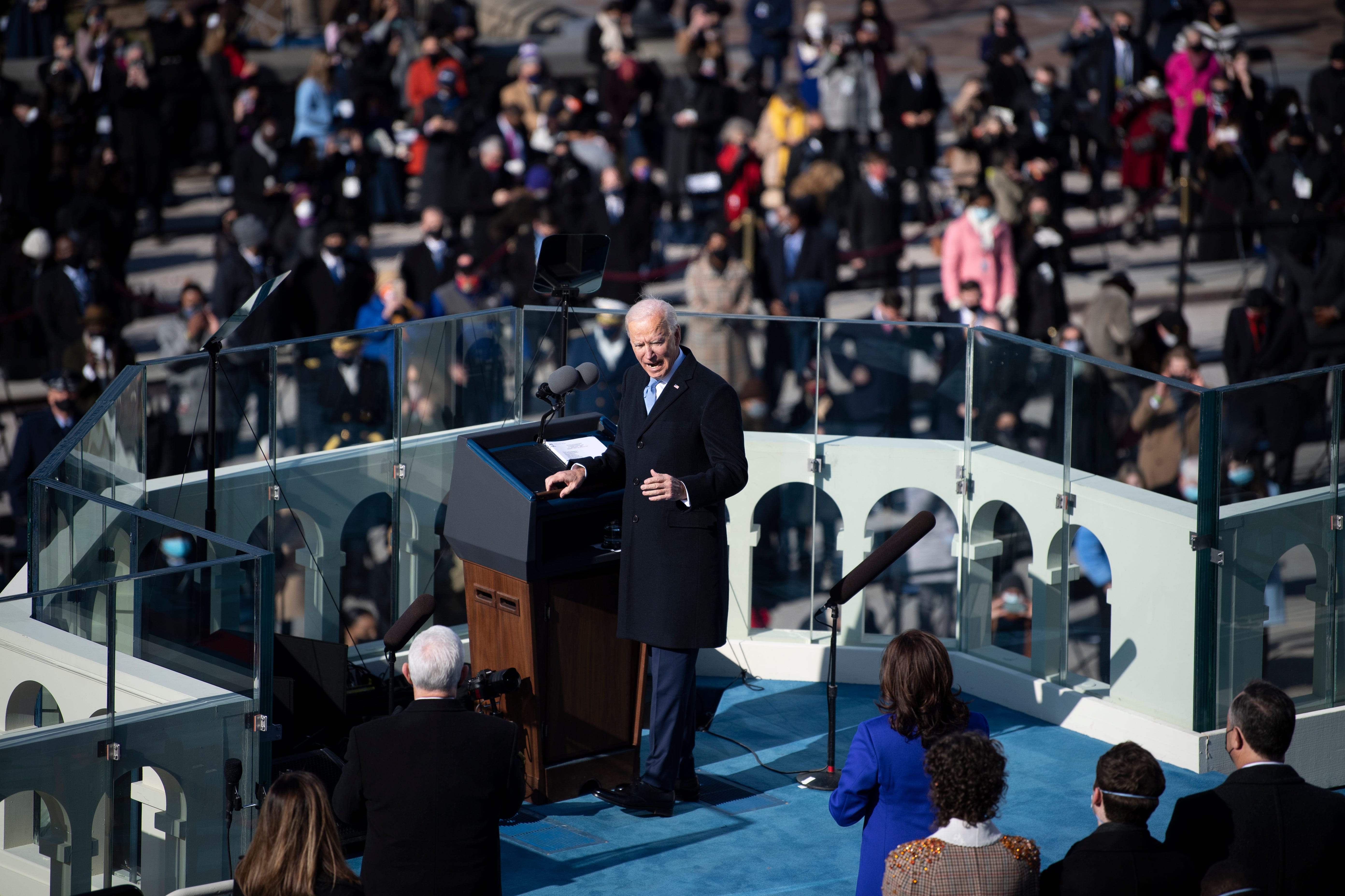 President Joe Biden looks back towards Vice President Kamala Harris as he delivers his inaugural address after he was sworn in as the 46th President of the United States, Wednesday, Jan. 20, 2021, at the U.S. Capitol in Washington.