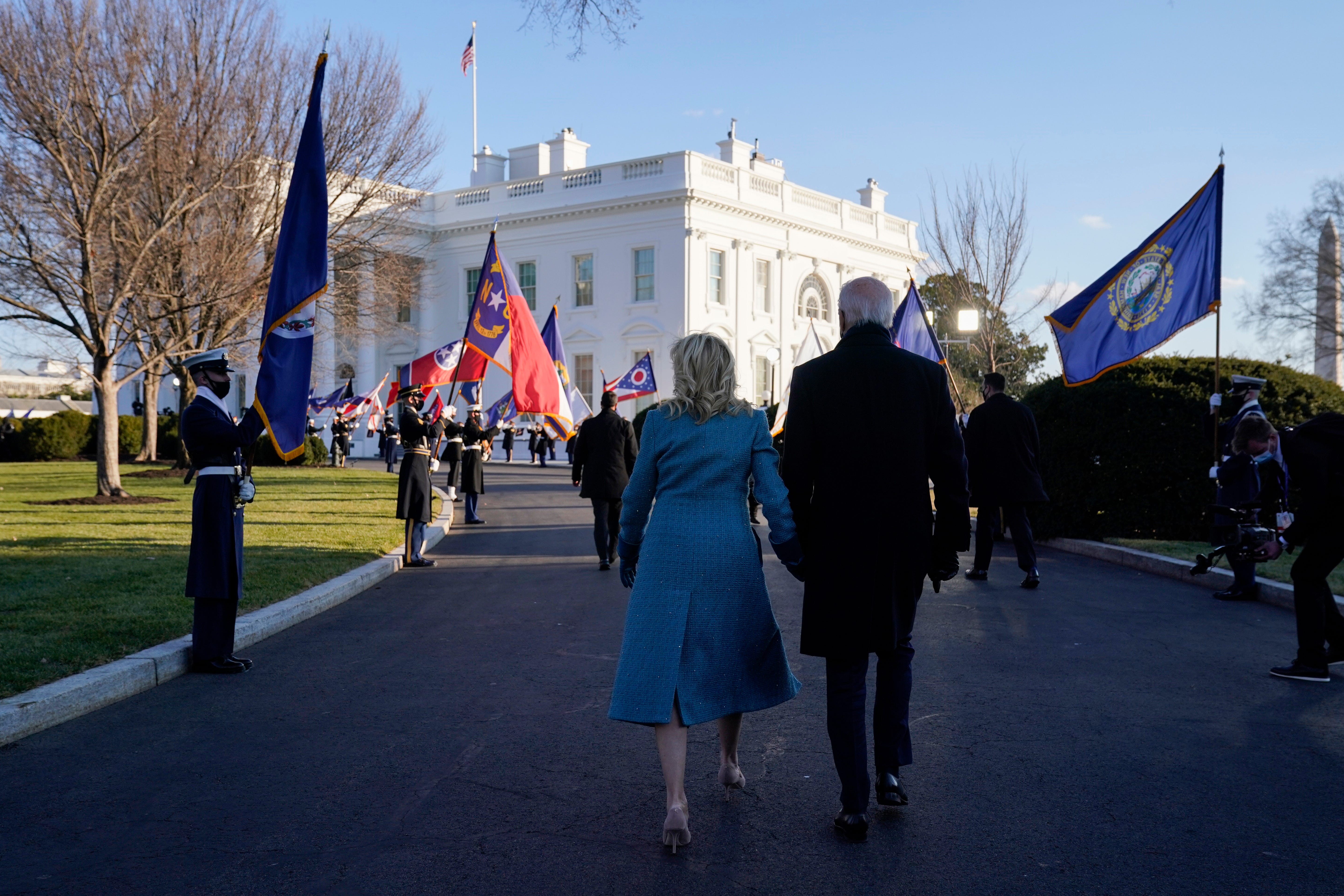 President Joe Biden walks with first lady Jill Biden to the White House during Inauguration Day ceremonies, Wednesday, Jan. 20, 2021, in Washington.