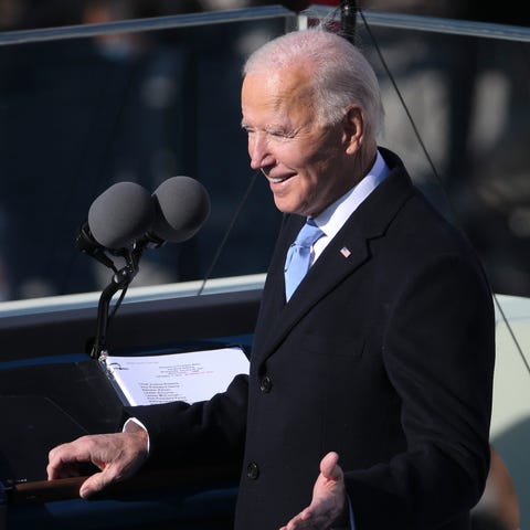 President Joe Biden gestures to stage members befo