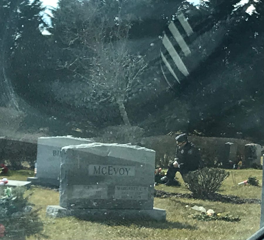 While Joe Biden gave his inauguration speech on Wednesday afternoon, a lone man in a blue uniform kneeled at the grave of Biden's son Beau Biden at St. Joseph on the Brandywine church in Greenville, Del.