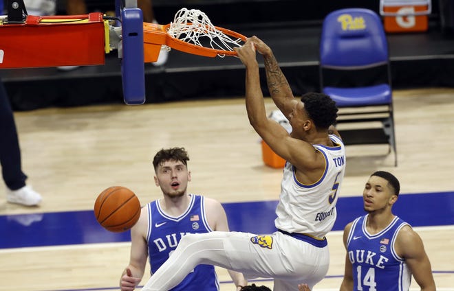 Pitt's Au'Diese Toney (5), a Trinity Christian School graduate, logged another big-time game against Duke with 22 points and 11 rebounds in the Panthers' 79-73 win against the Blue Devils on Tuesday.