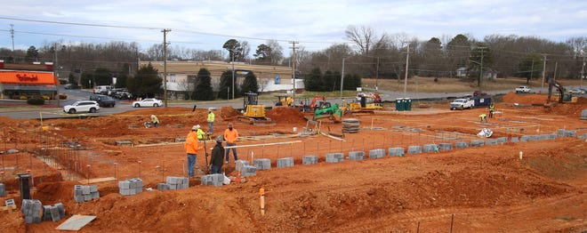 Construction continues on a new hotel at the corner of North New Hope Road and Remount Road Thursday morning, Jan. 21, 2021.