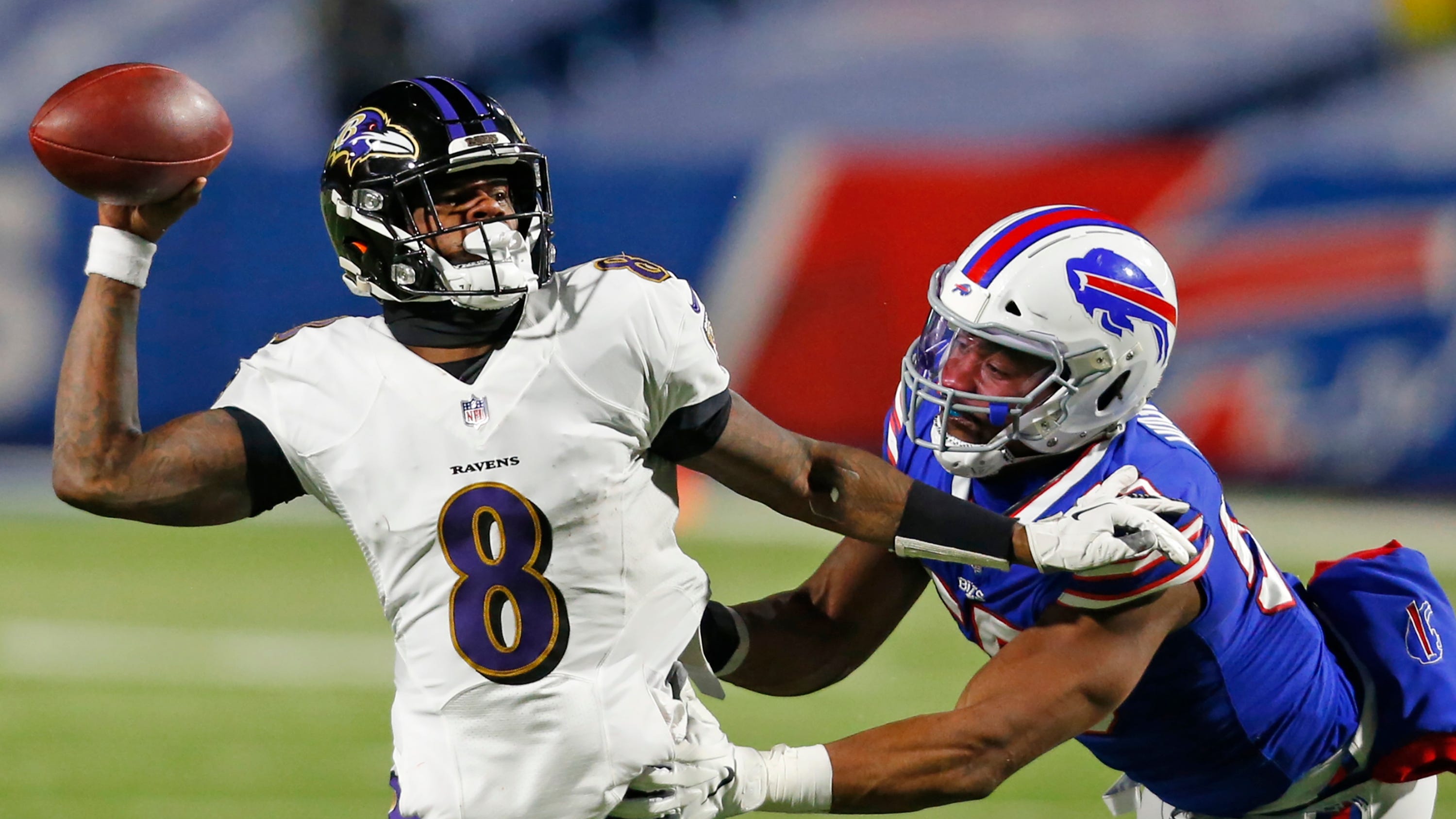 Buffalo Bills defensive end Jerry Hughes pressures Baltimore Ravens quarterback Lamar Jackson during an NFL divisional playoff game Jan. 16, 2021, in Orchard Park, N.Y.