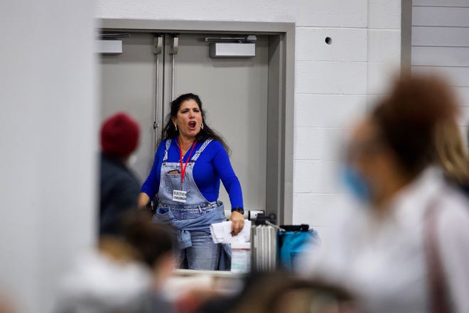 An election challenger reacts as she was asked to leave the room that absentee votes are being counted at the TCF Center in Detroit, Wednesday, Nov. 4, 2020.