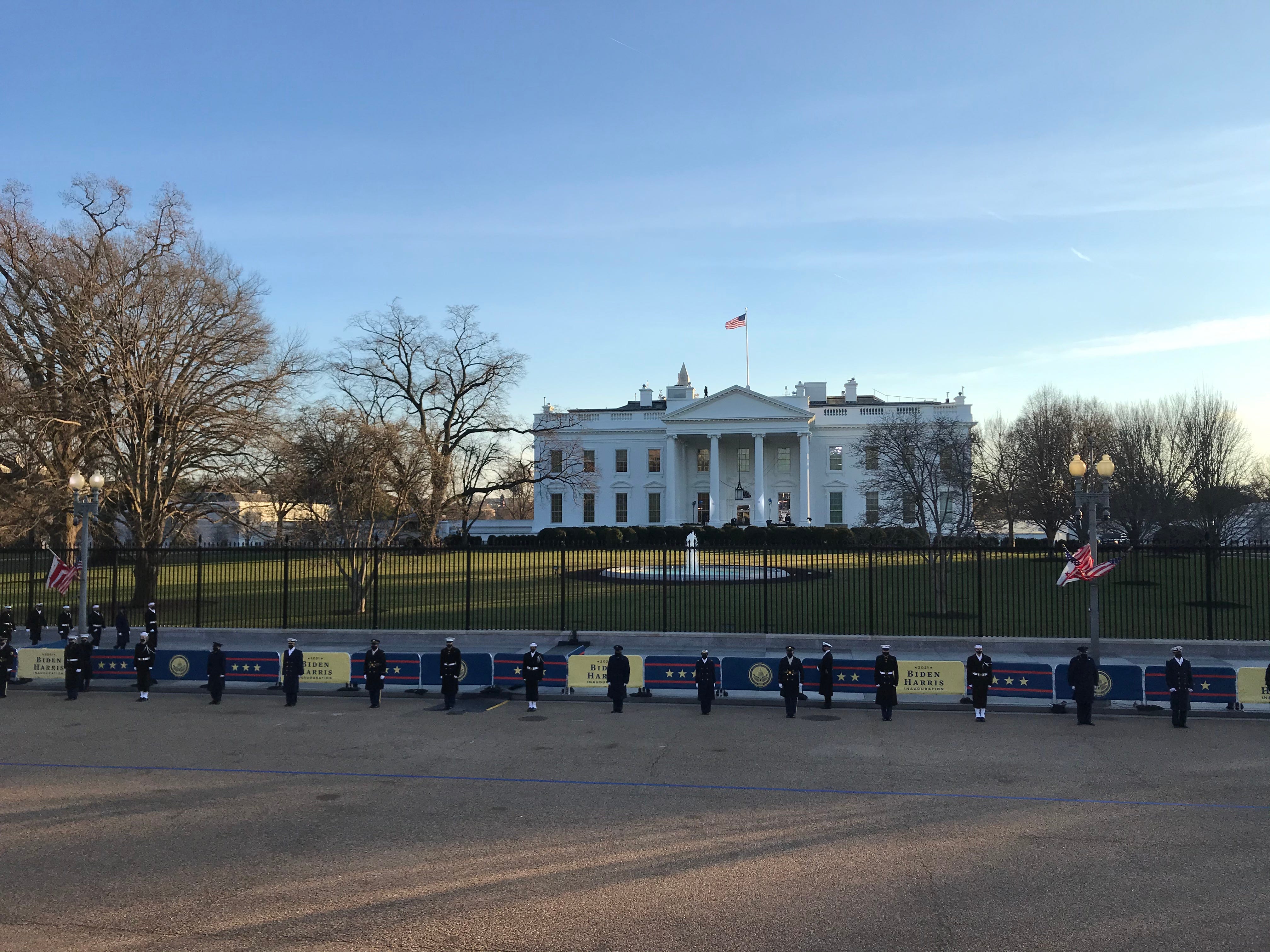 Military officials line up in preparation for President Joe Biden's motorcade on Wednesday, Jan. 20. The Delawarean was sworn in as the 46th president in a muted ceremony on Wednesday.