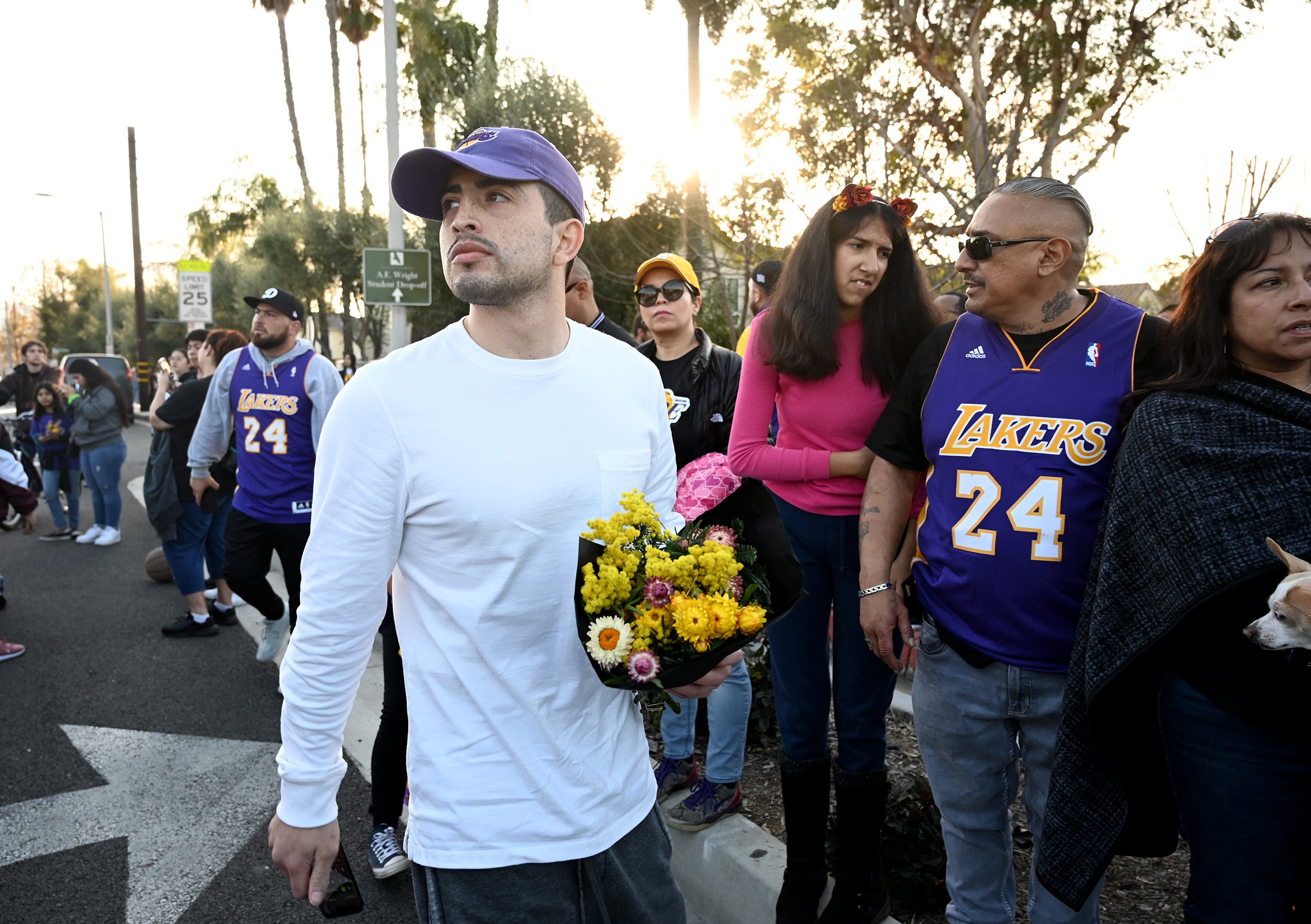 Fans gather in Calabasas, California near the hillside where the helicopter crashed carrying Kobe Bryant.
