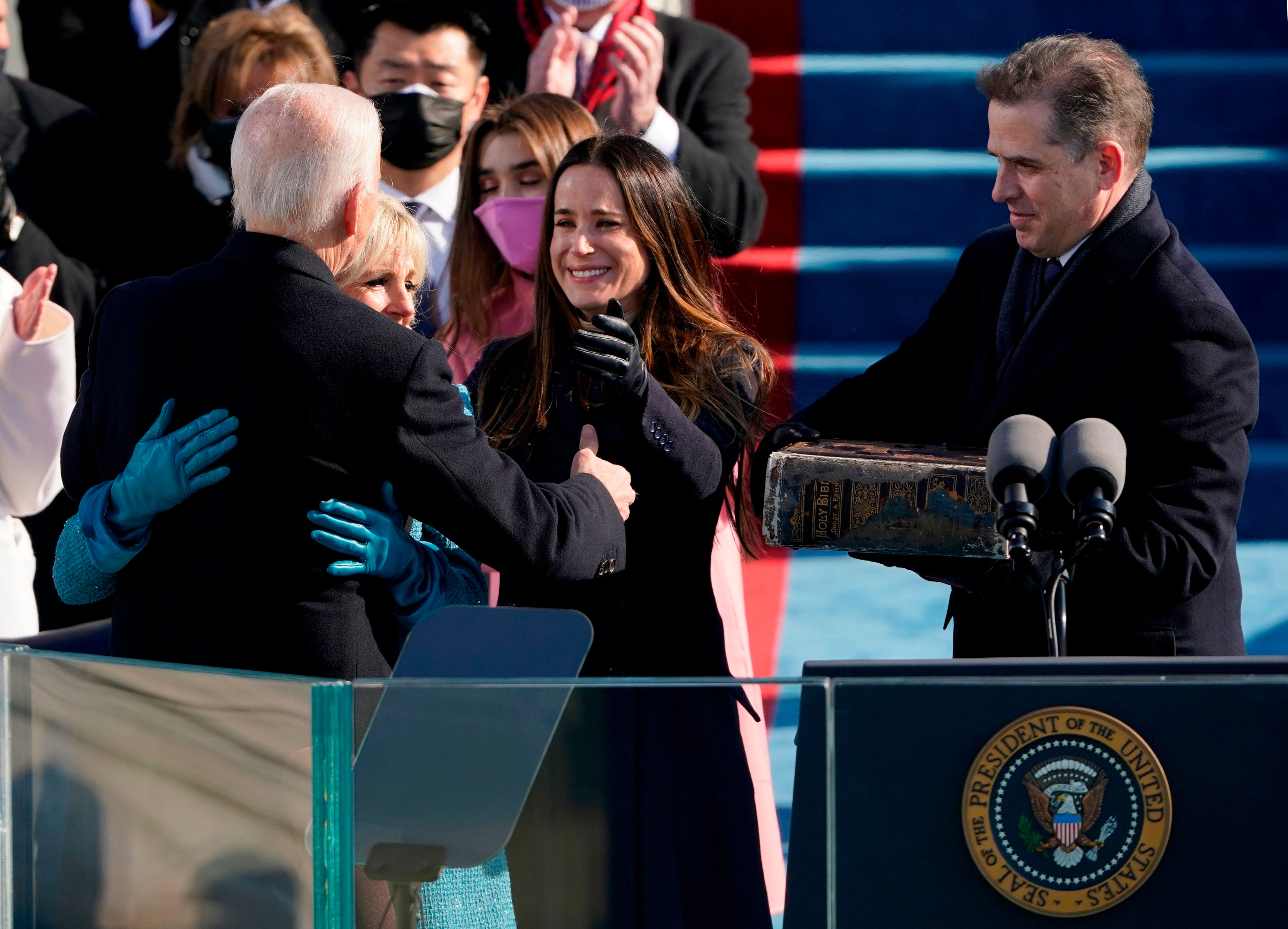 President Joe Biden is congratulated by First lady Jill Biden and children Ashley (second from right) and Hunter (right) after being sworn-in during the 59th Presidential Inauguration on January 20, 2021, at the US Capitol in Washington, DC.