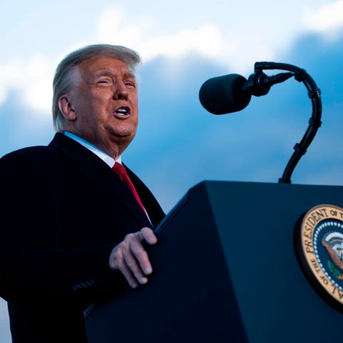 Outgoing US President Donald Trump addresses guest