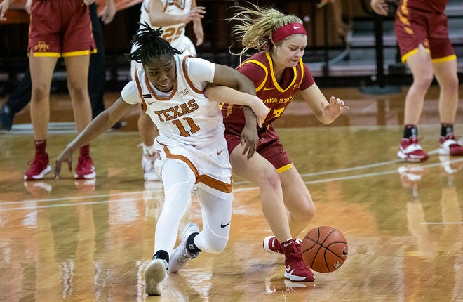 Texas guard Joanne Allen-Taylor and Iowa State's Maggie Espenmiller-McGraw scramble for a loose ball at the Erwin Center during their game at the Erwin Center on Jan. 3.