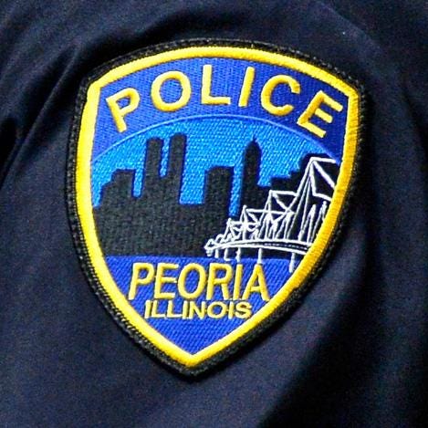A Peoria police badge is shown in a file photo