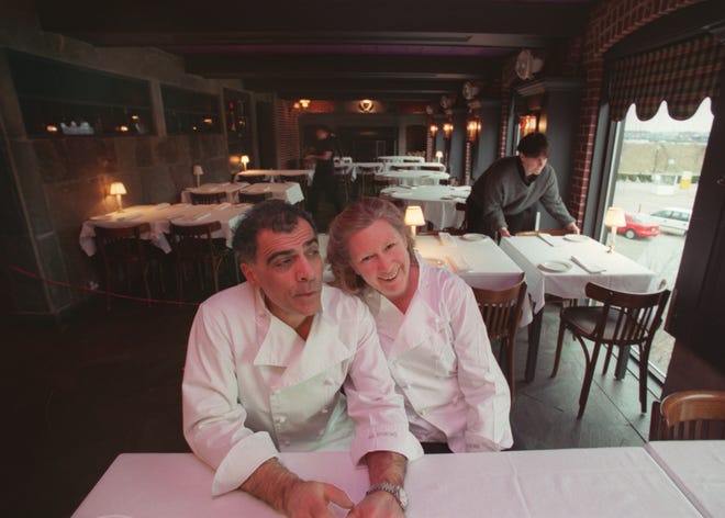 In this 2003 photo, George Germon and Johanne Killeen take a moment as the tables of the upstairs dining room are being prepared for the evening.