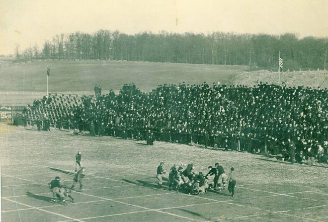 Action from when Canton and Massillon played in 1906 displays how a pro football field was marked off in a 5-yard by 5-yard grid to assist game officials with the rules in place then. Historians believe that the term “gridiron” was a result.