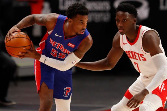 Detroit Pistons guard Delon Wright is defended by Houston Rockets guard Victor Oladipo during the first quarter Friday, Jan. 22, 2021 at Little Caesars Arena.