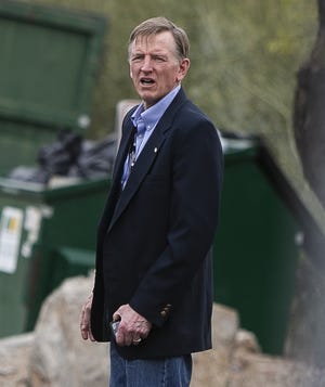 Rep. Paul Gosar walks to his car after speaking at the Arizona Republican Party state meeting at Dream City Church in Mesa, Ariz. on Jan. 23, 2021.