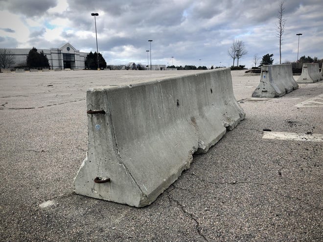 Barriers at the Silver City Galleria in Taunton block vehicles from entering most parking areas.