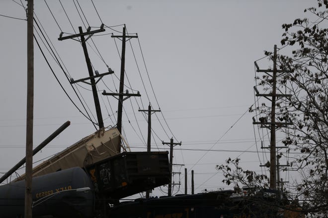 Seven cars derailed on top of the CSX Railroad bridge overtop on Gest Street in Queensgate Sunday morning. Duke Energy has also responded to the scene.