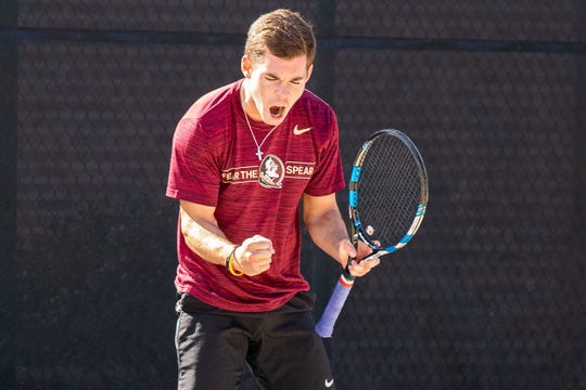 Chase Wood celebrates winning a point at the Scott Speicher Memorial Tennis Center in Tallahassee, FL.