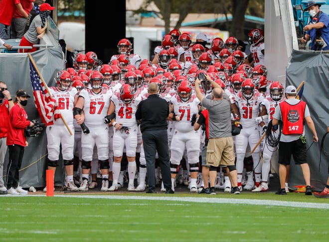 Jan 2, 2021; Jacksonville, FL, USA; North Carolina State Wolfpack ready to take the field before a game against the Kentucky Wildcats at TIAA Bank Field. Mandatory Credit: Mike Watters-USA TODAY Sports