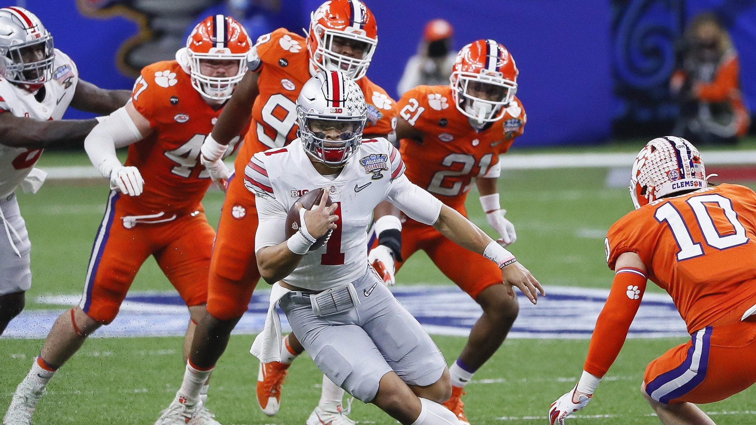 Ohio State quarterback Justin Fields rushes during the College Football Playoff semifinal against Clemson at the Allstate Sugar Bowl in the Mercedes-Benz Superdome in New Orleans on Jan. 1, 2021.