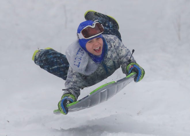 Twelve-year-old Andrew Elliott sleds at Kletzsch Park in Glendale on January 28, 2019.