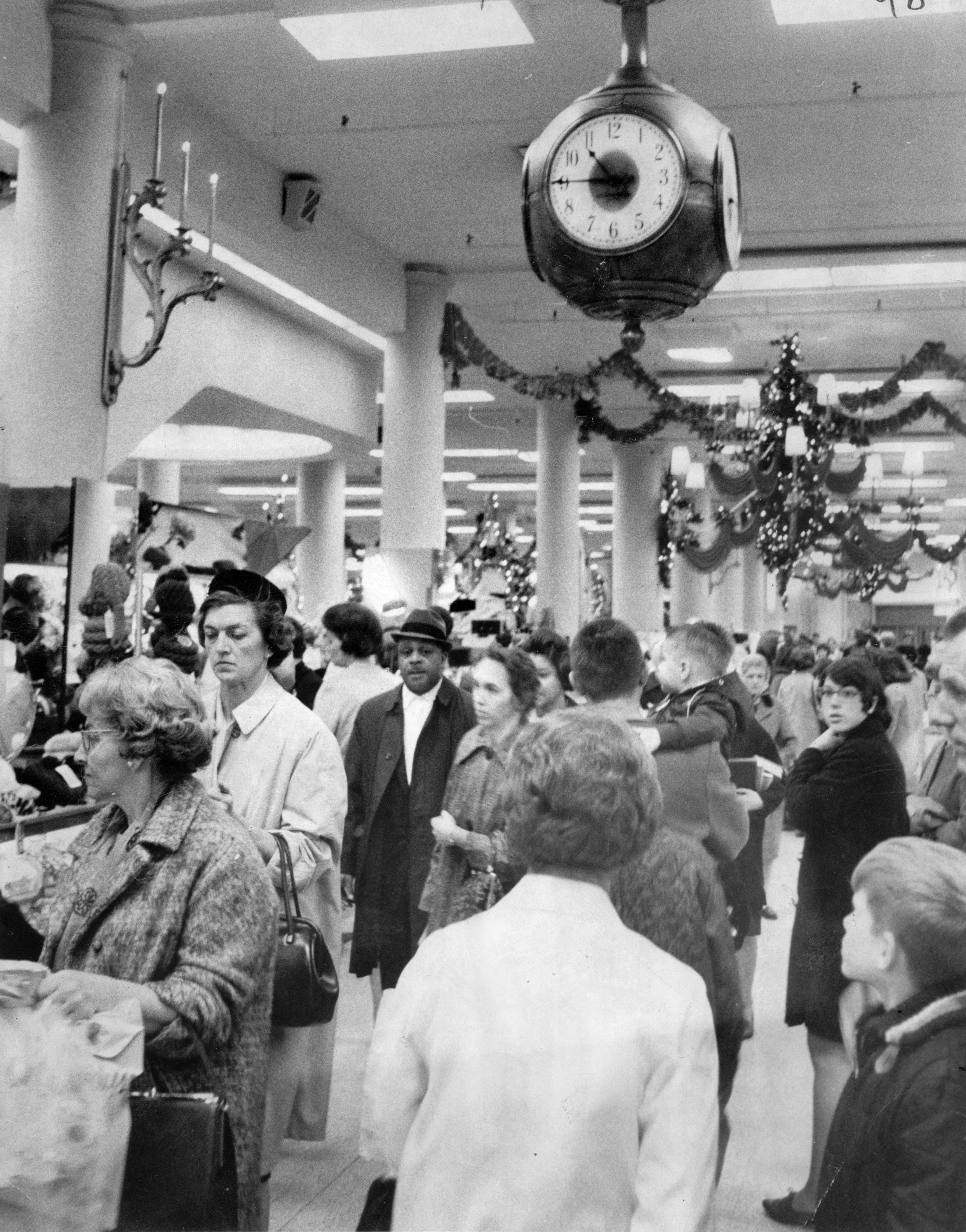 Christmas shoppers crowd the aisles under the clock in Sibley's on Nov. 25, 1966.