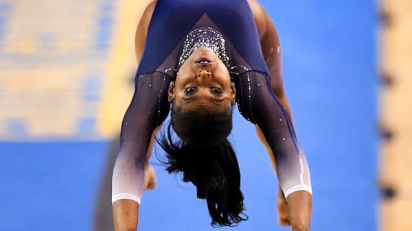 UCLA gymnast Nia Dennis competes in the vault agai
