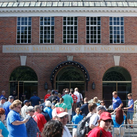 Fans walk outside the Baseball Hall of Fame in Coo