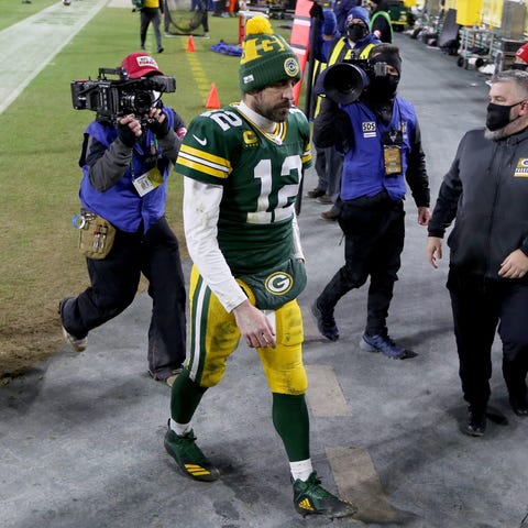 Green Bay Packers quarterback Aaron Rodgers walks 