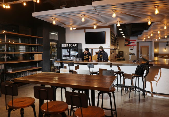 Crafted Culture in Gahanna is the first Black-owned brewery in central Ohio. Peyton, left, and Zac Baaske, right, get the brewery ready for opening on Tuesday, January 26, 2021. Peyton is responsible for food and events, while Zac is the brewer. Both are part of the ownership group.